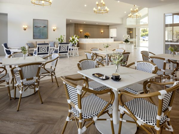 Interface carpet tiles in an aged care facility café and foyer area at Arcare Warners Bay, showing durable flooring in a high-traffic common space