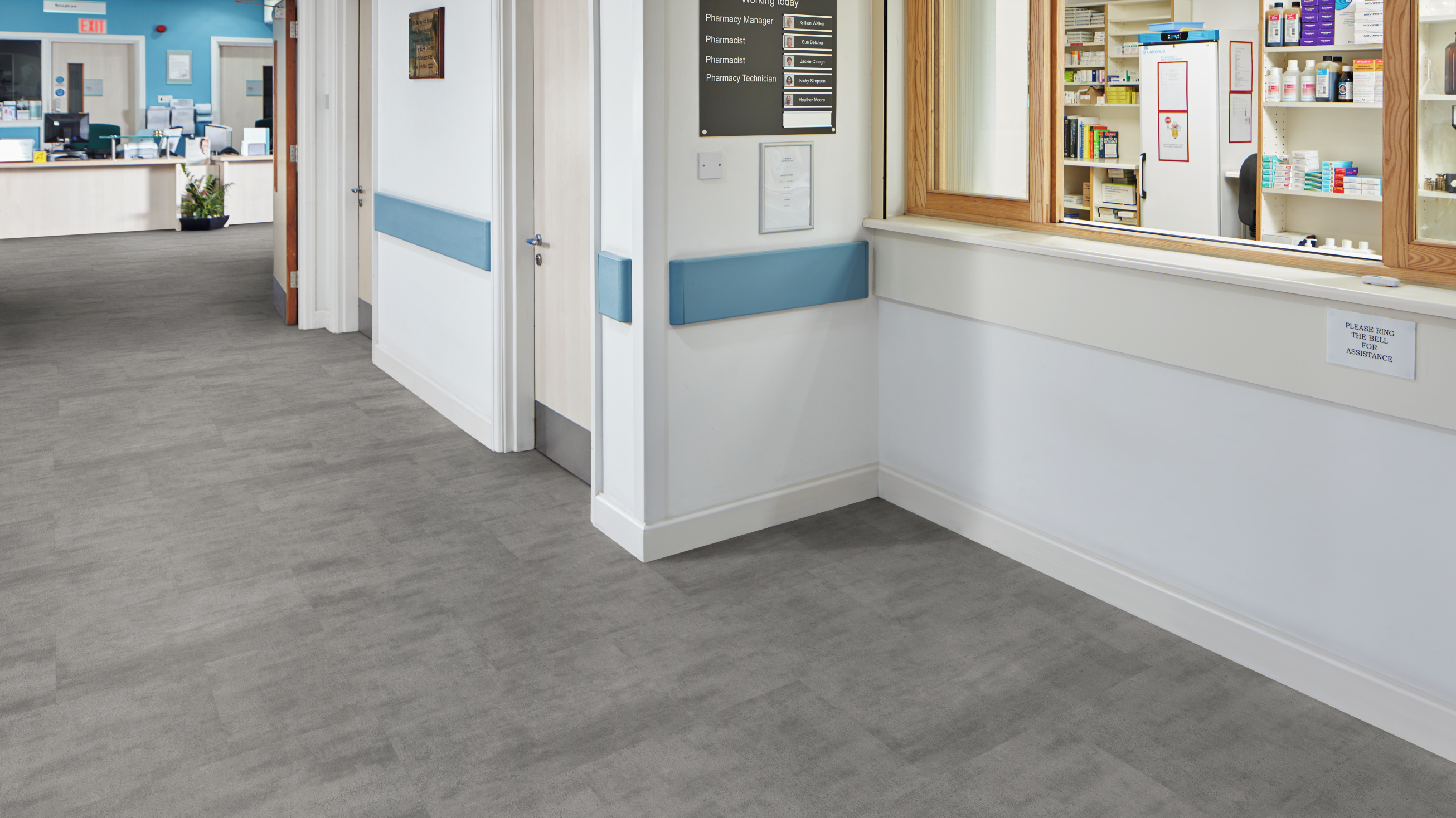 Karndean Vermont luxury vinyl tile in a healthcare hallway, showing warm wood-effect design that creates residential feel in clinical environments
