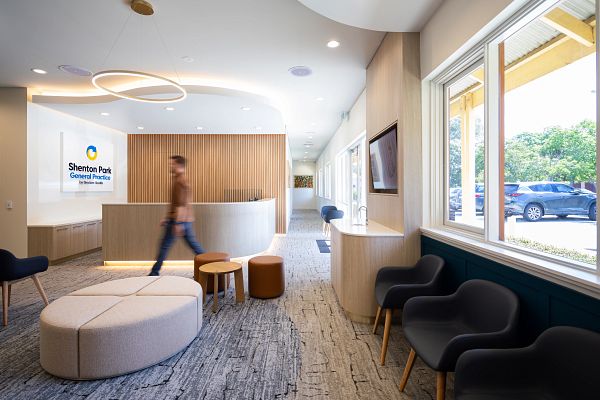 Shaw Contract carpet tiles installed in a healthcare facility corridor, showing durable modular flooring suitable for aged care environments